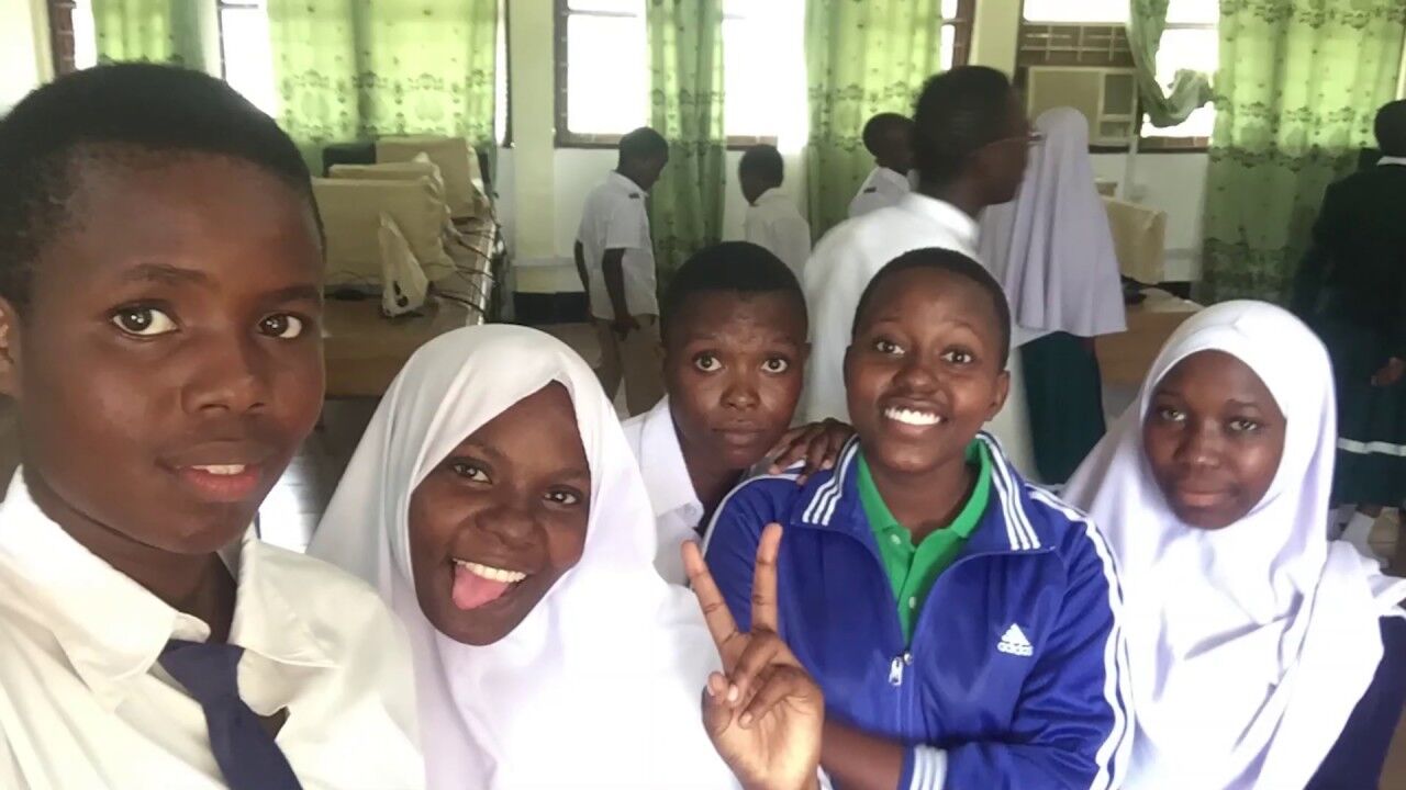 TME Education Club members showcasing their project during the Graduation Ceremony at their school! (Mtwara, Tanzania)